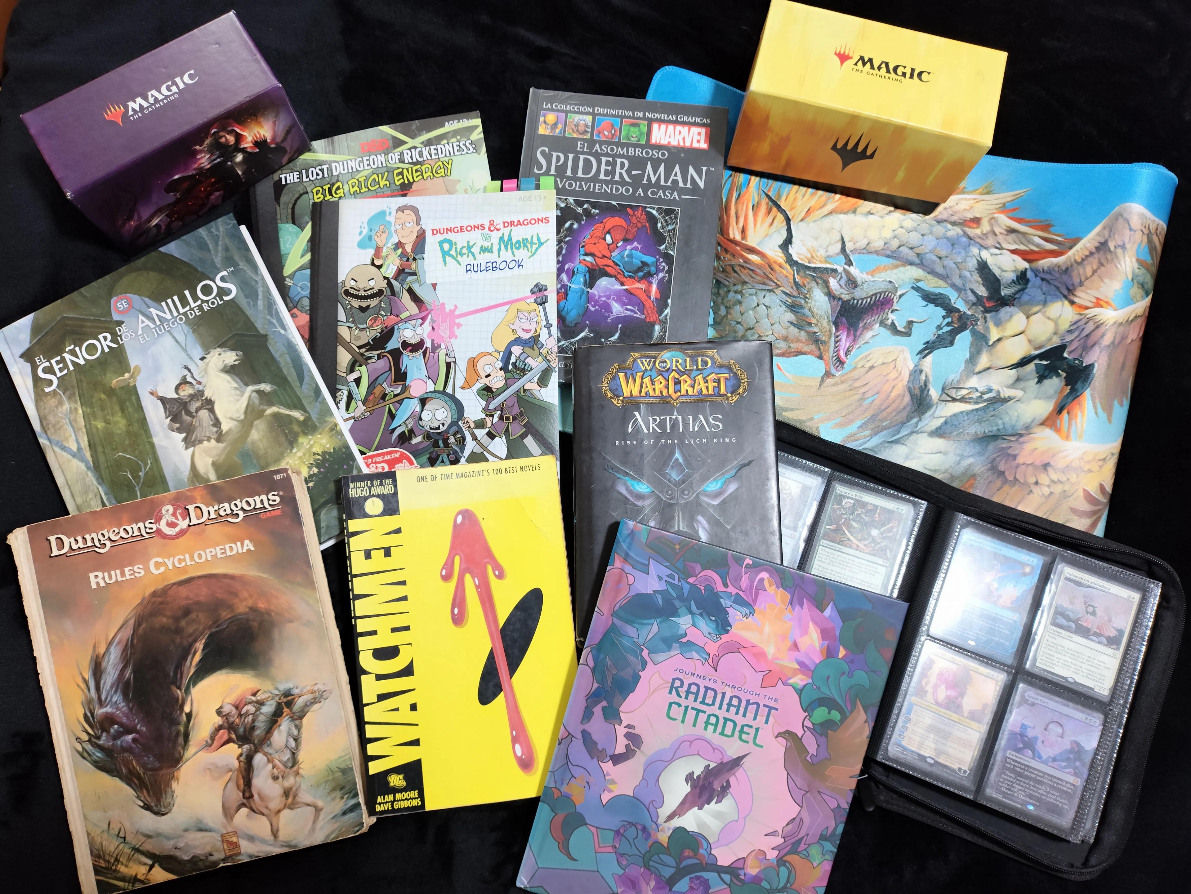 Geek collection with fantasy books, comics, and game cards