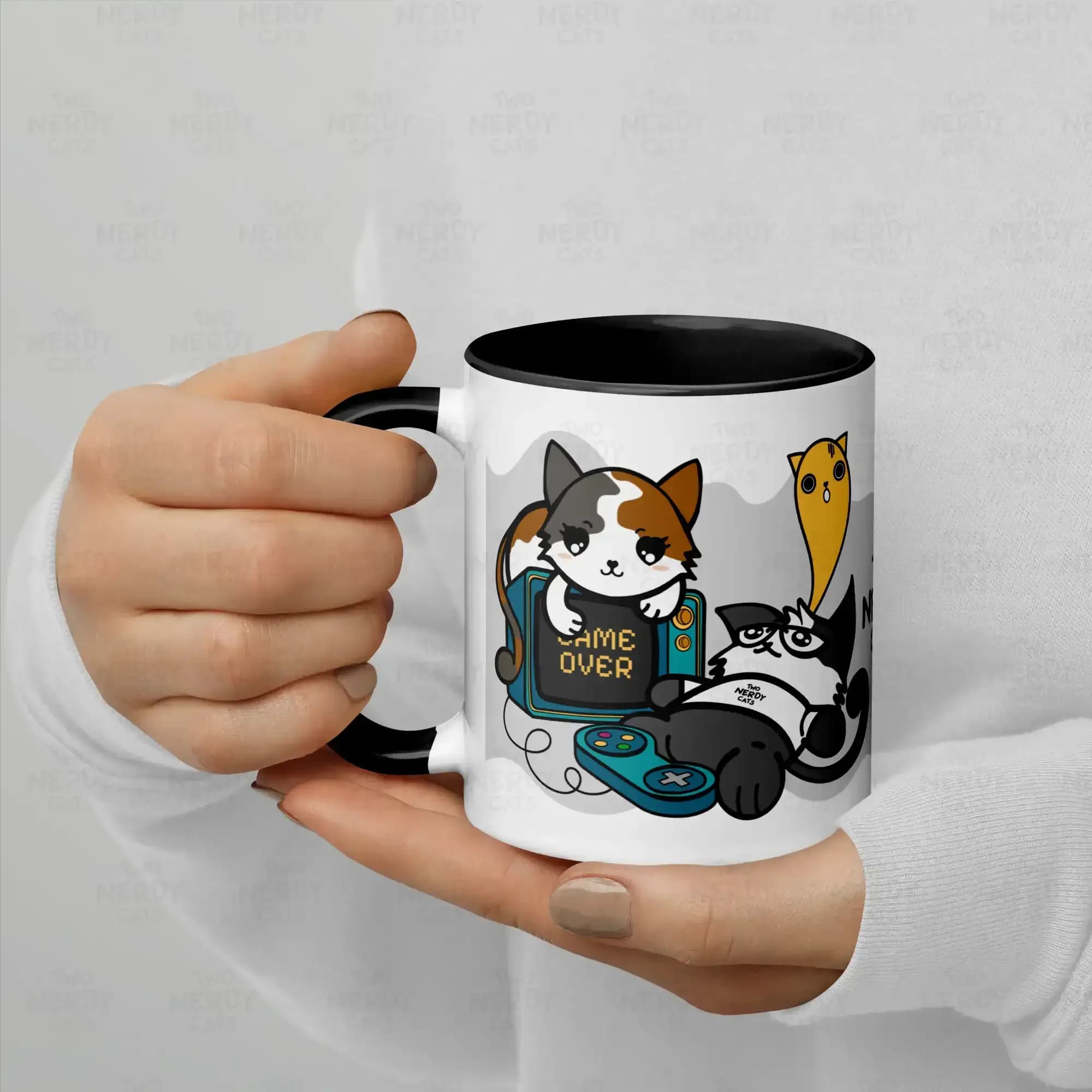 Woman in white sweater holding Two Nerdy Cats "Cece Dom Game Over" mug of two cats playing retro video games