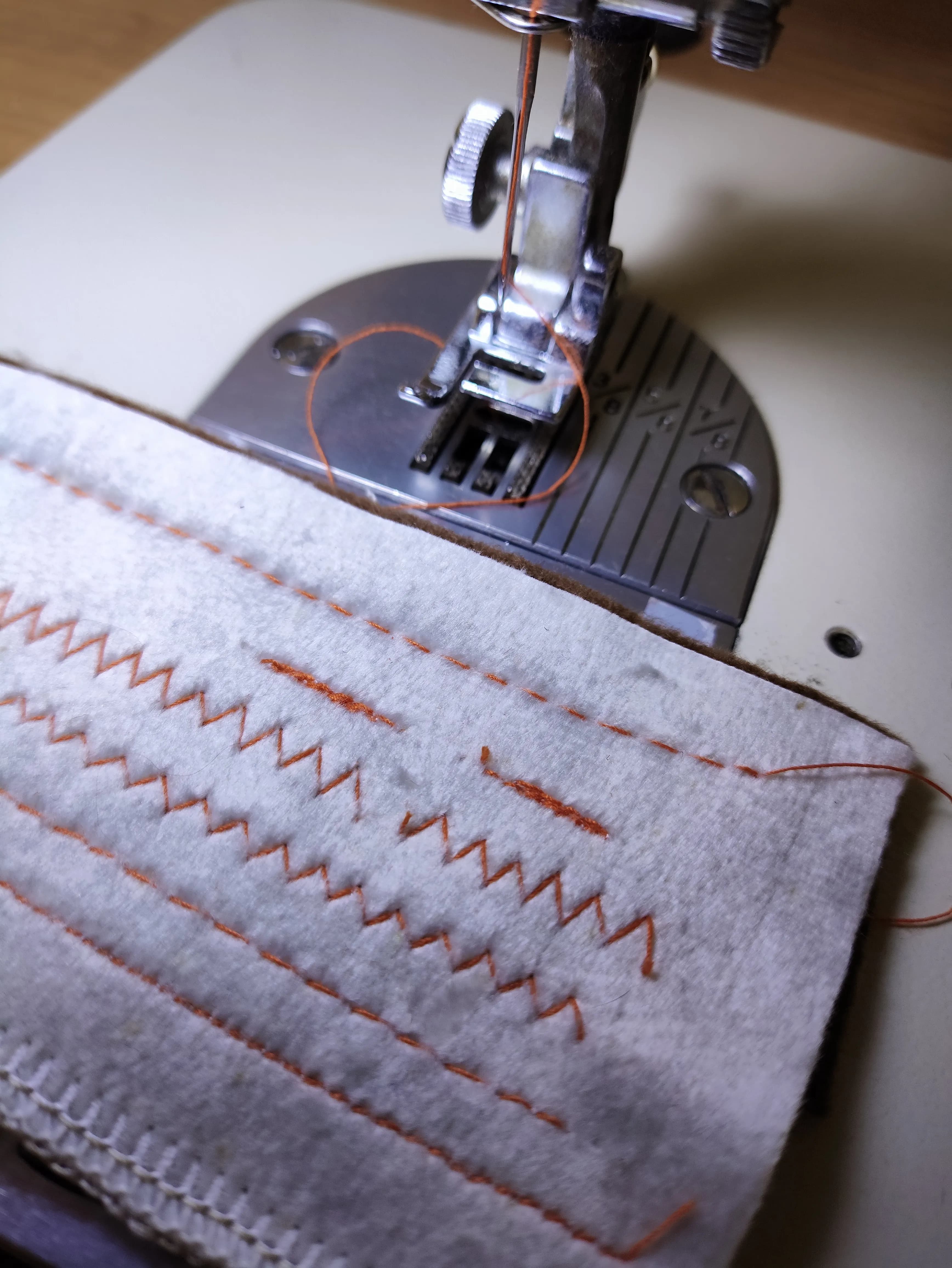 Sewing machine stitching multiple sample lines to test different stitch types